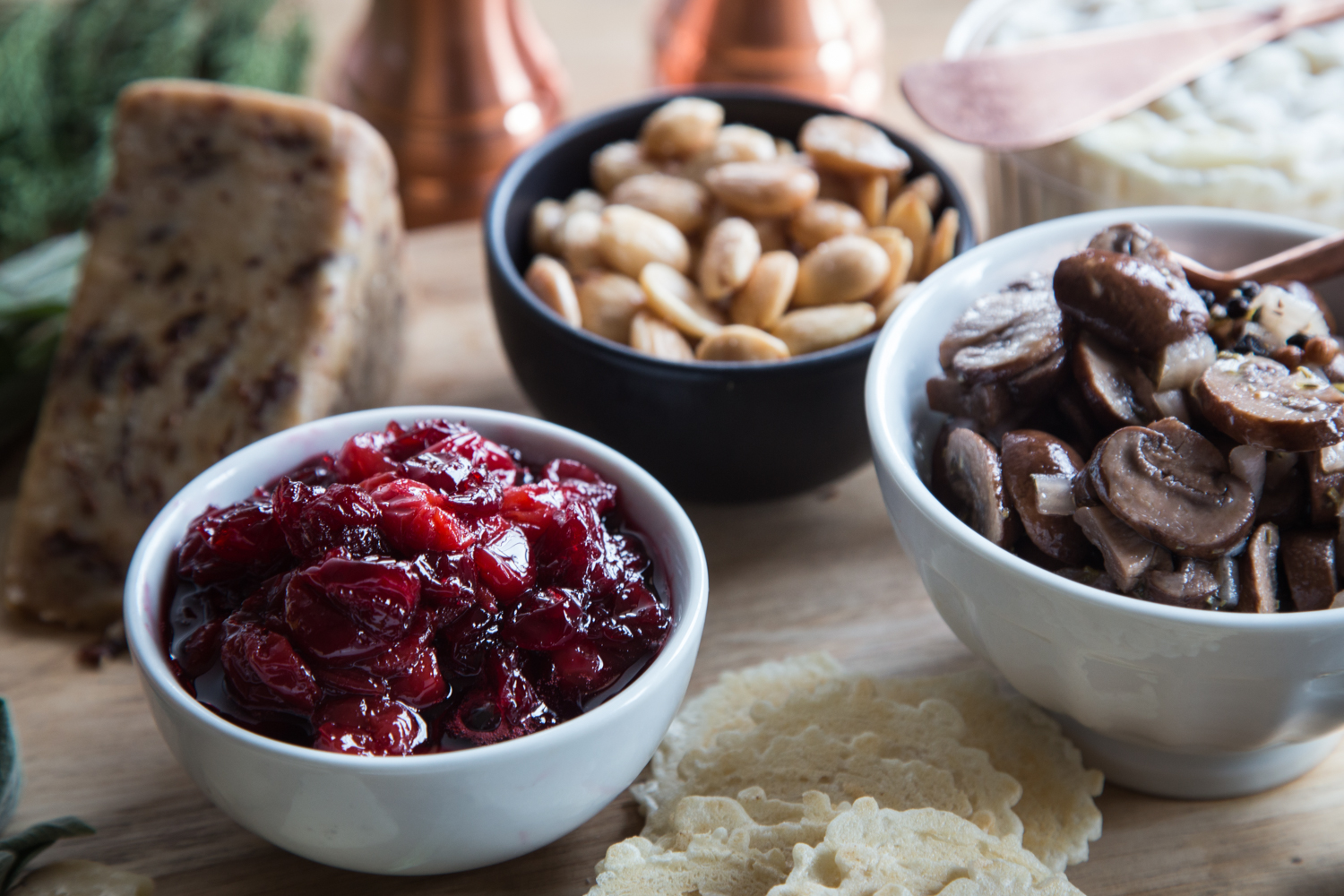 A Holiday Cheese Board needs a few extras to go with the cheese. Try marinated mushrooms, Tart Cherry Bourbon Compote, and salty Marcona almonds.