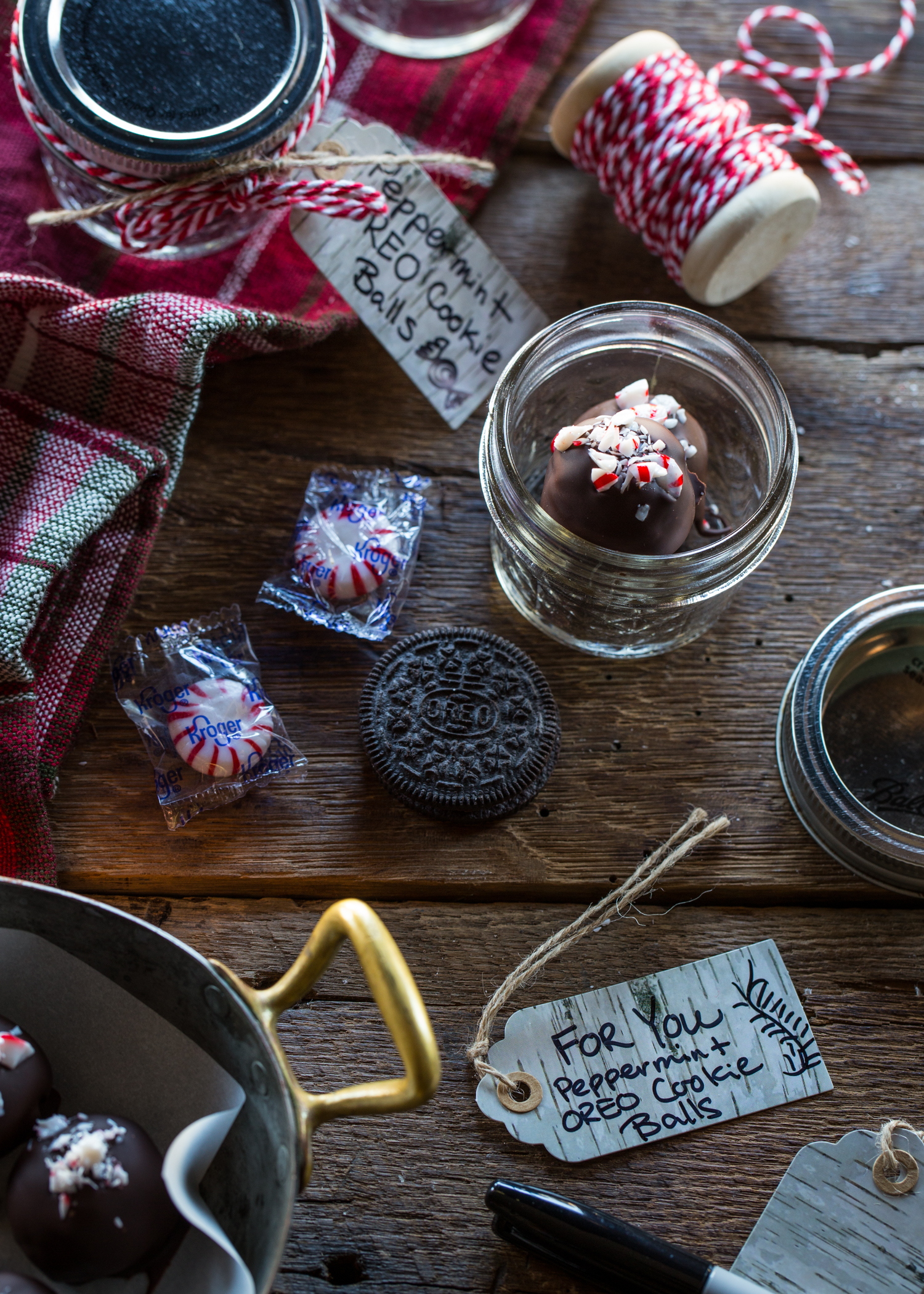 Peppermint OREO Cookie Balls make wonderful gifts when packaged in simple mason jars and decorated with ribbon. So cute!