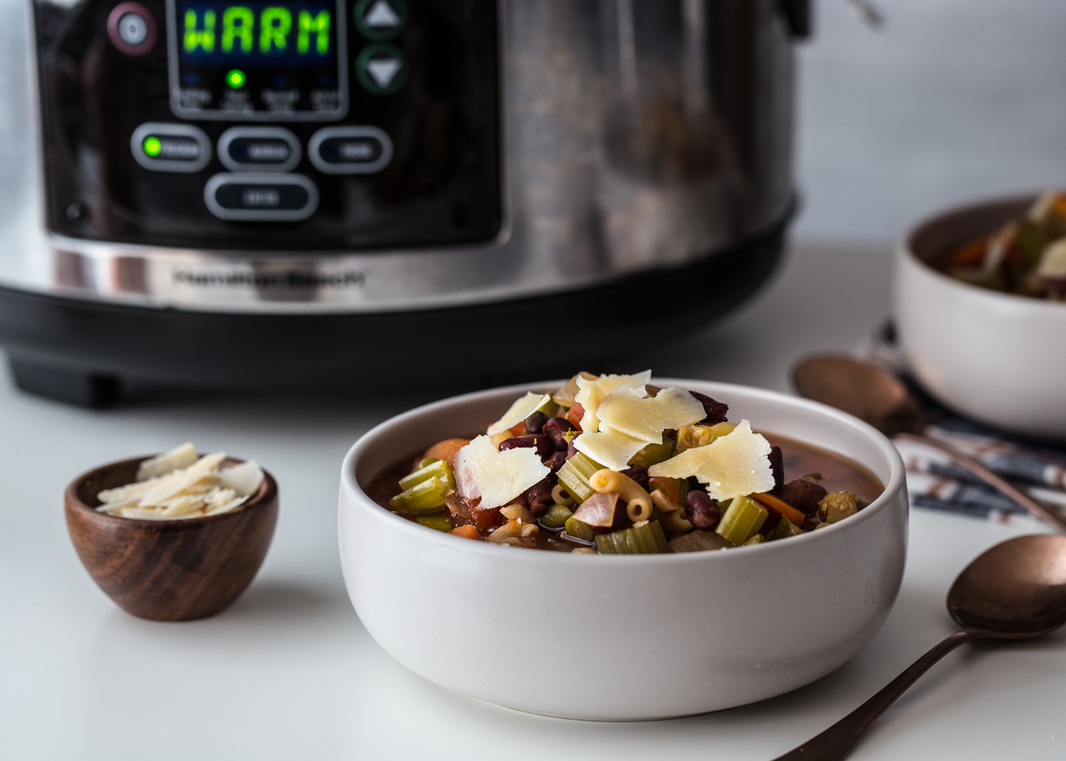 Slow Cooker Minestrone Soup full of chunky vegetables and topped with parmesan cheese