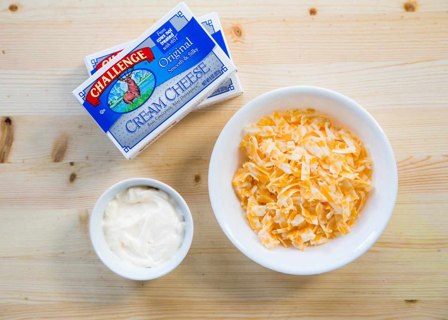 Baked Vegetable Cheese Dip made with spring vegetables, Challenge Dairy cream cheese, mayo, and shredded colby jack cheese