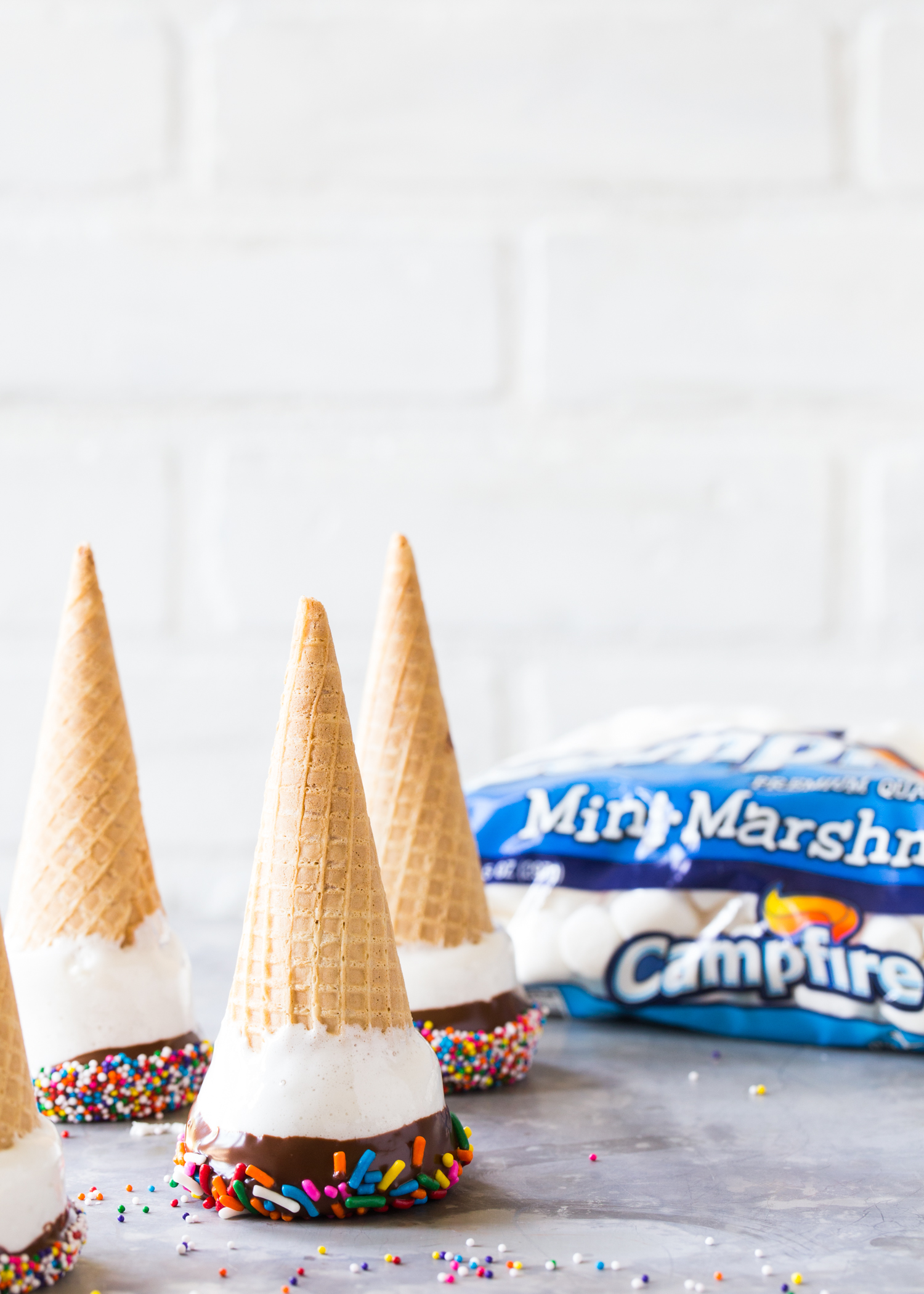 Marshmallow Dipped Ice Cream Cones made with melted marshmallows, chocolate, and sprinkles!