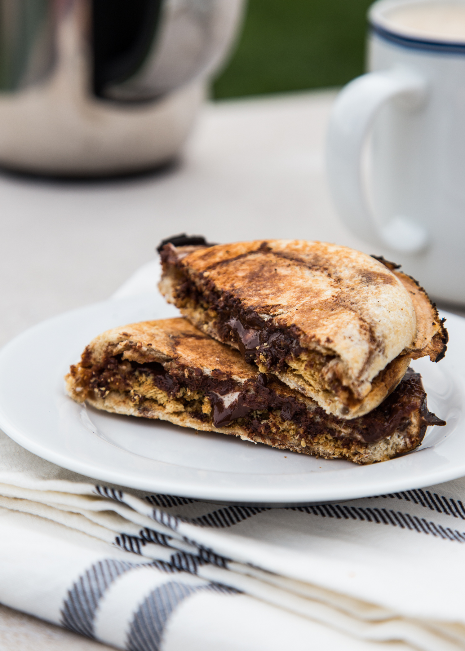 S'mores Pudgy Pies made with Campfire® Marshmallows, chocolate chips, crushed graham crackers all wrapped up in cinnamon swirl bread