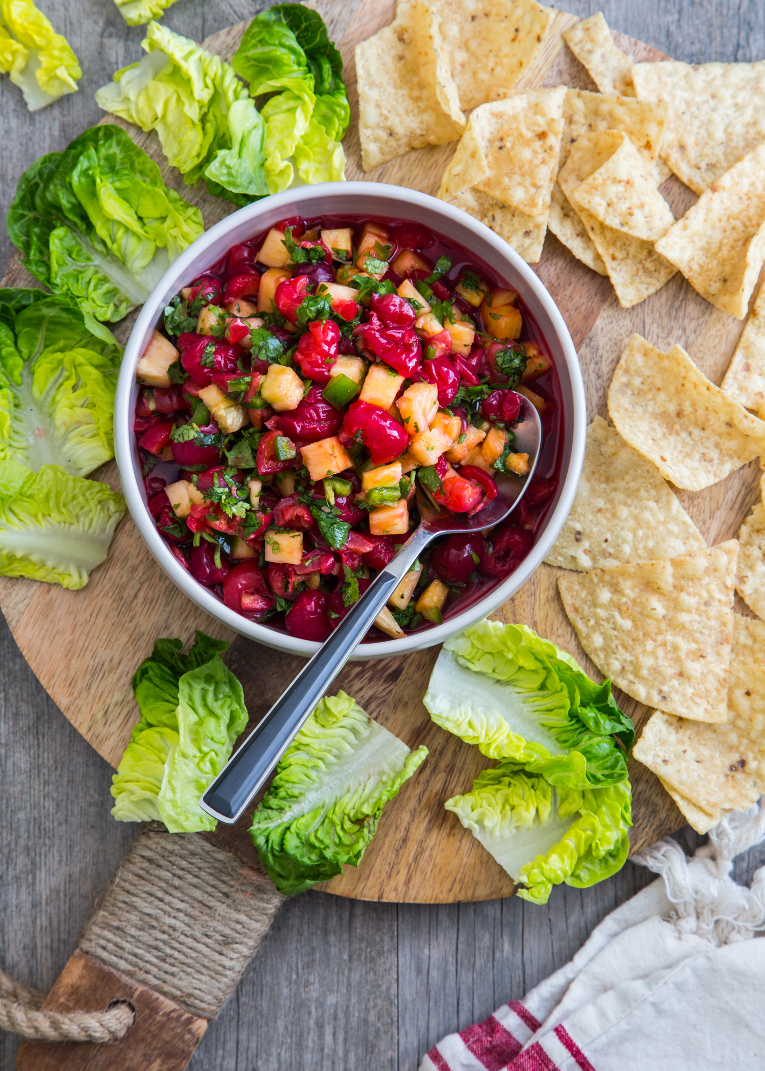 Montmorency Cherry Pineapple Salsa served with corn chips and lettuce cups for a great backyard bbq snack!