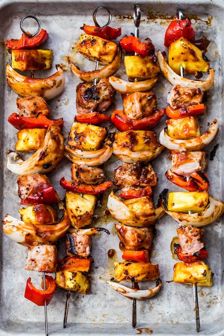 Sweet and Tangy Pork Kabobs with juicy pork, sweet red peppers, tangy pineapple, and spicy onions