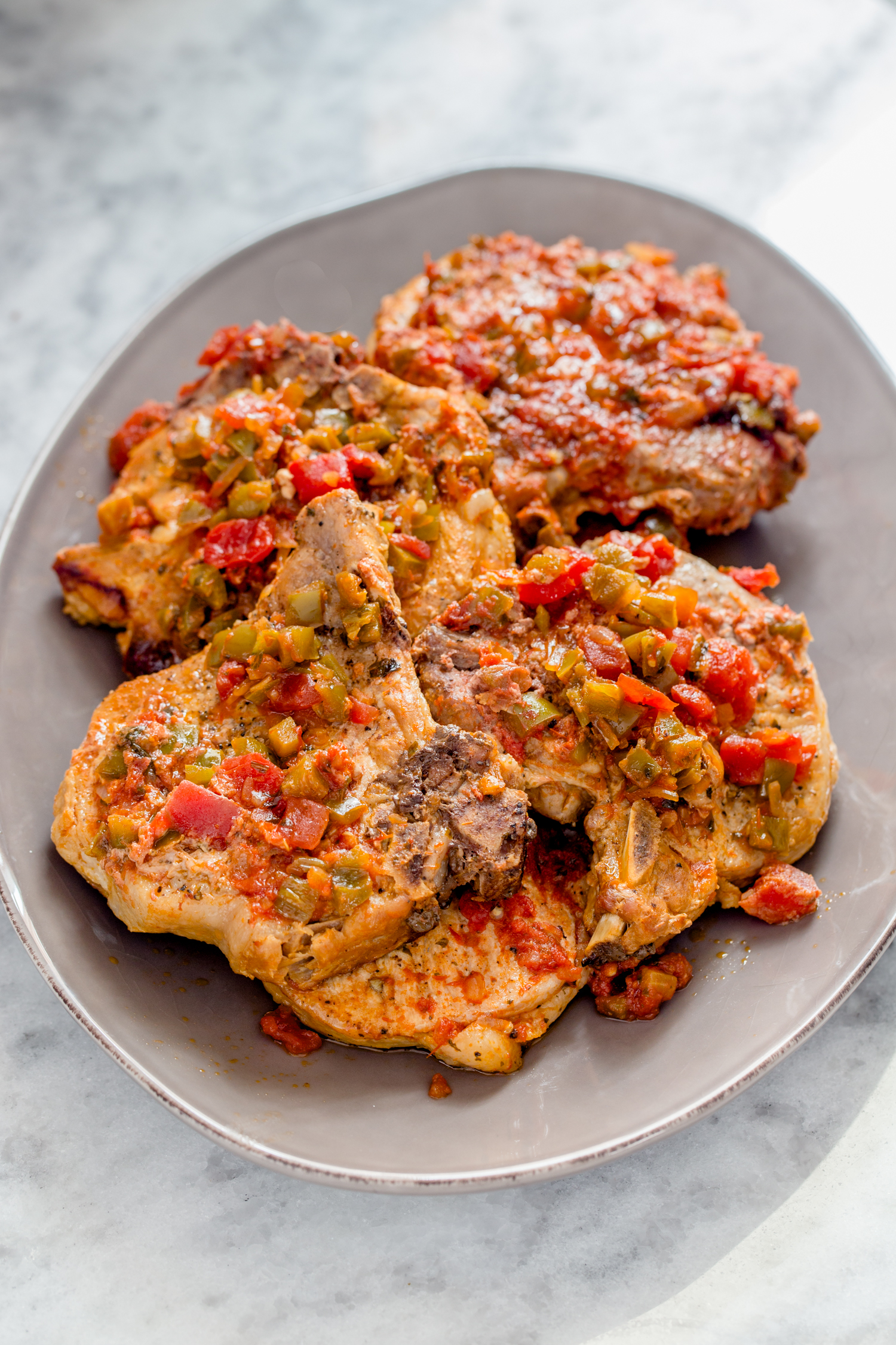 platter of pork chops with salsa