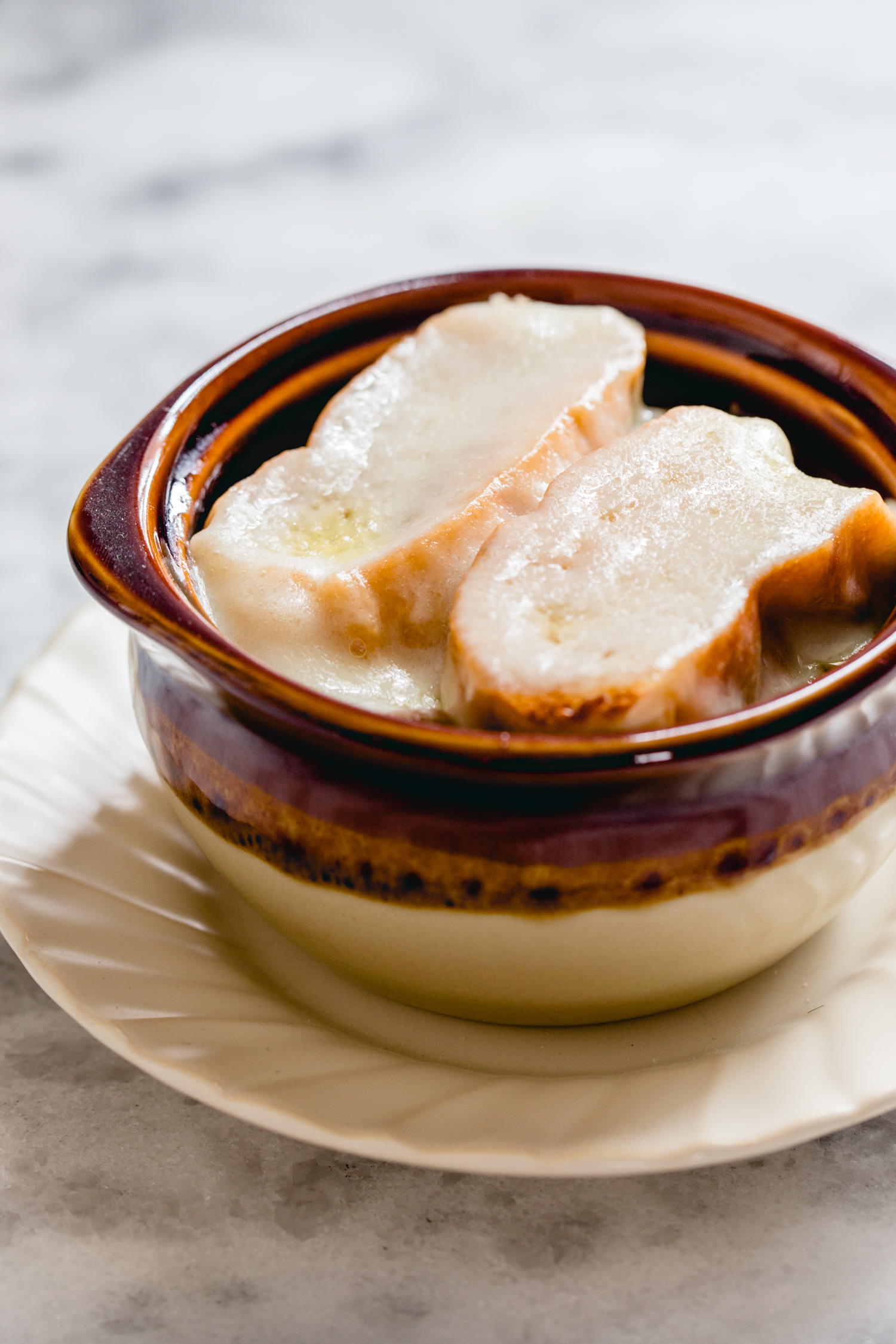 bowl of soup with toast and cheese