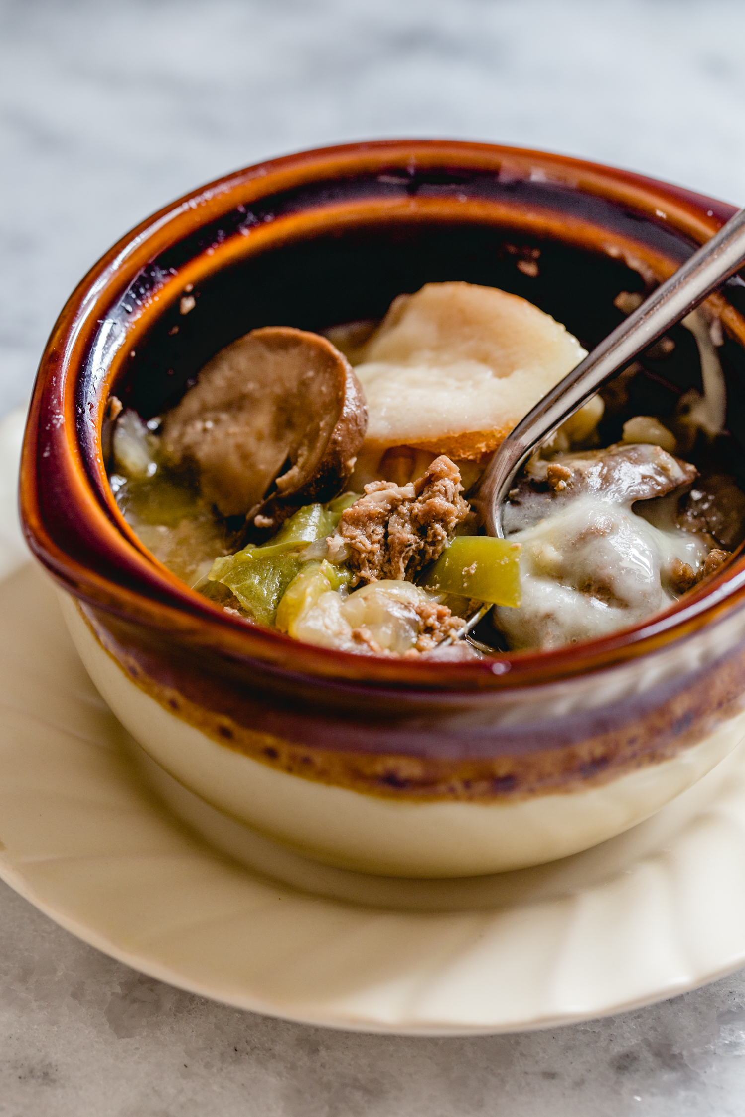 bowl of soup with steak and mushrooms