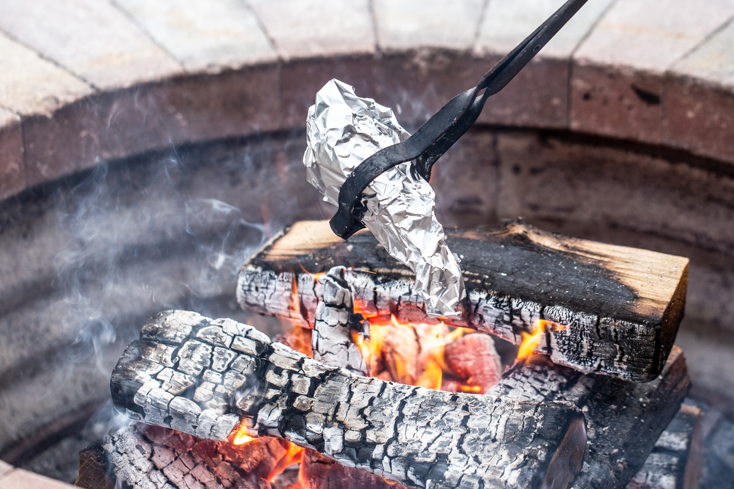 roasting smores cones over campfire